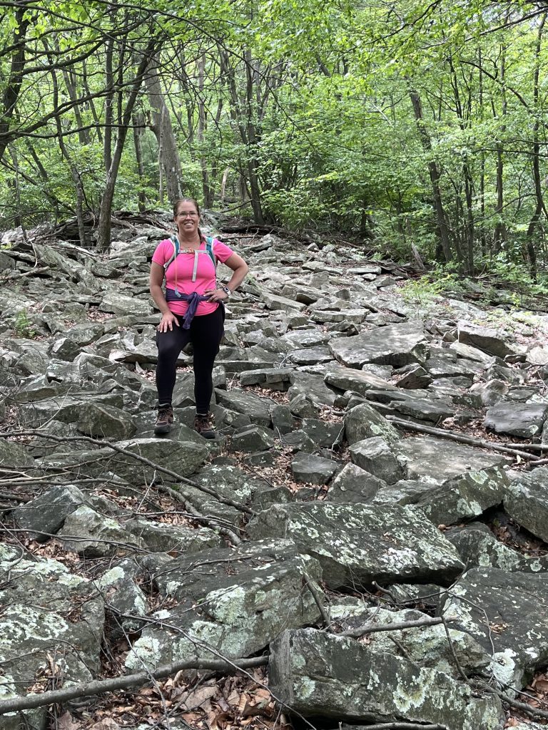 Hiker navigating a rocky section of the Appalachian Trail in Pennsylvania