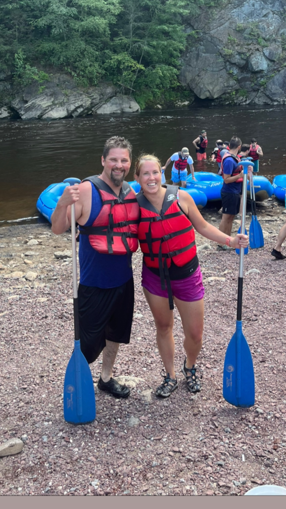 Wearing a life jacket before our Pocono Whitewater rafting adventure near Jim Thorpe, Pennsylvania.