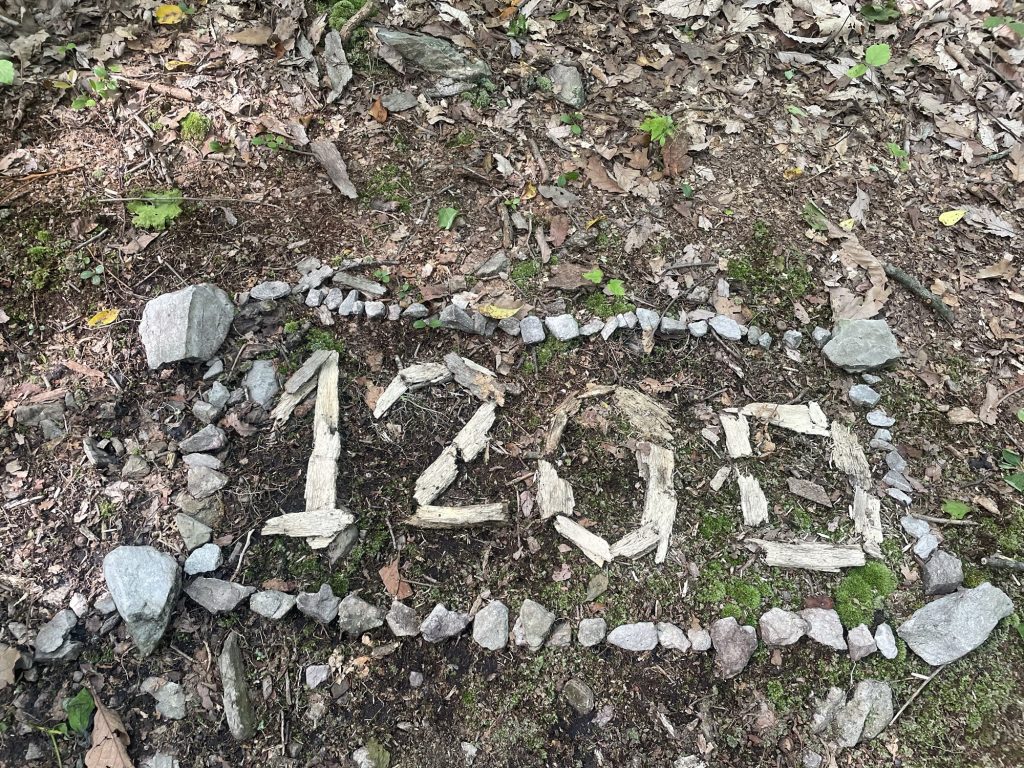 Handmade 1200-mile marker created from rocks and wood along the Appalachian Trail in Pennsylvania