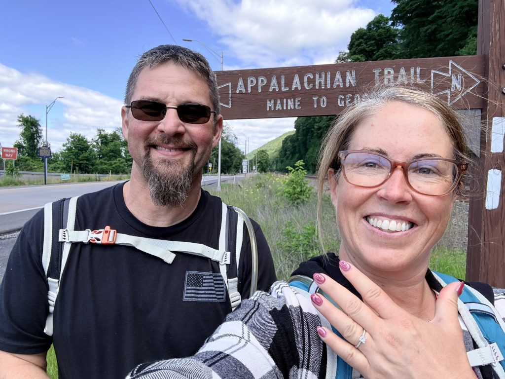 Couple celebrating their engagement after completing an Appalachian Trail hike in Pennsylvania