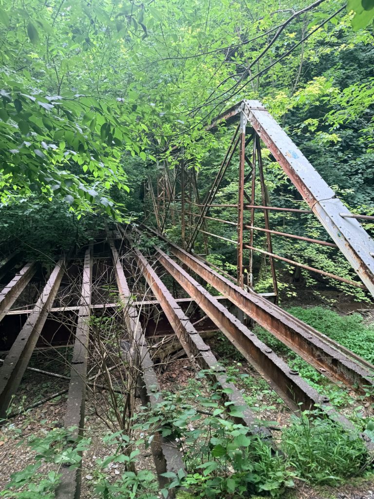 Abandoned steel truss bridge hidden in the forest near Kelly's Run Nature Preserve in Lancaster County, Pennsylvania.
