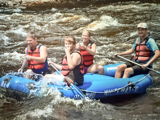 Our family navigating whitewater rapids during a Pocono Whitewater rafting adventure on the Lehigh River near Jim Thorpe, Pennsylvania.